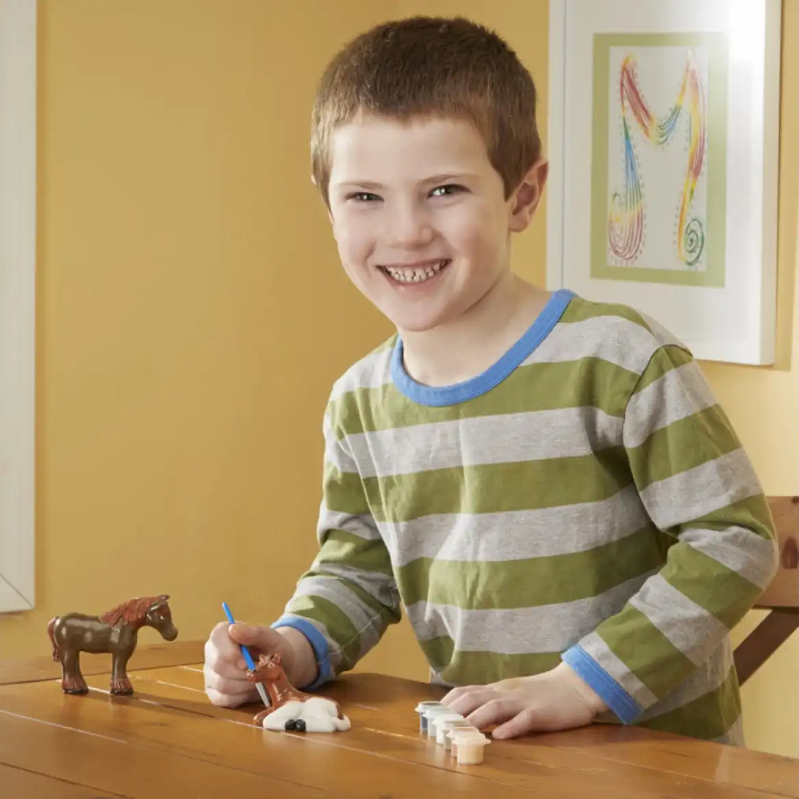 Create a unique collection of hand-painted horse figurines.