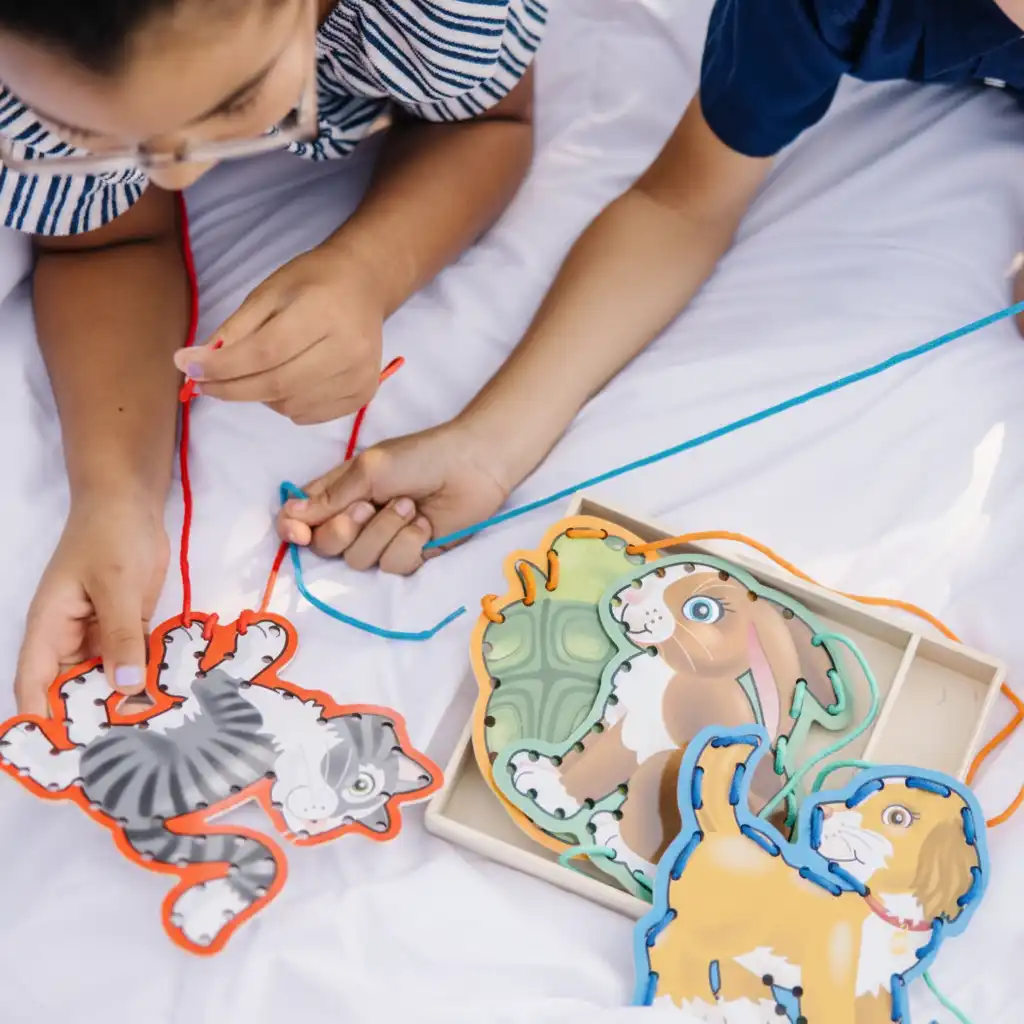 Improving fine motor skills through precise lacing.