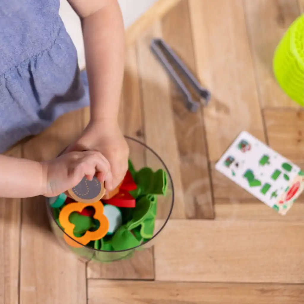 Fine motor skills training with tongs and mechanical salad spinner.